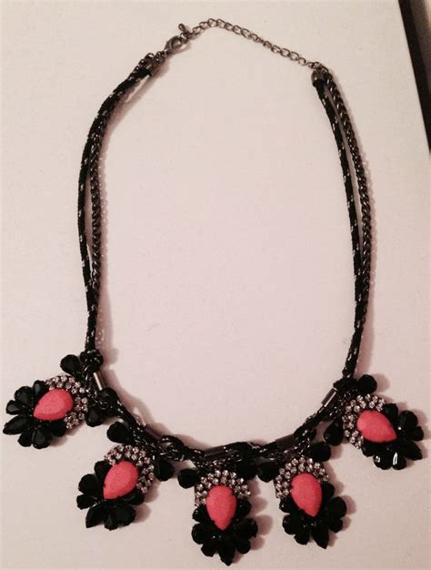 pink and black statement necklace.